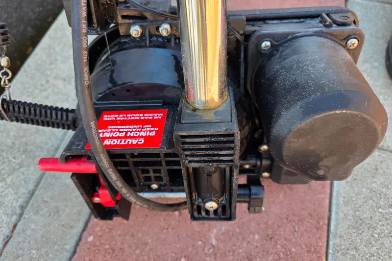 Slide: The Image of Close-up of a 2003 Boston Whaler 255 Conquest engine component with caution label. - 42
