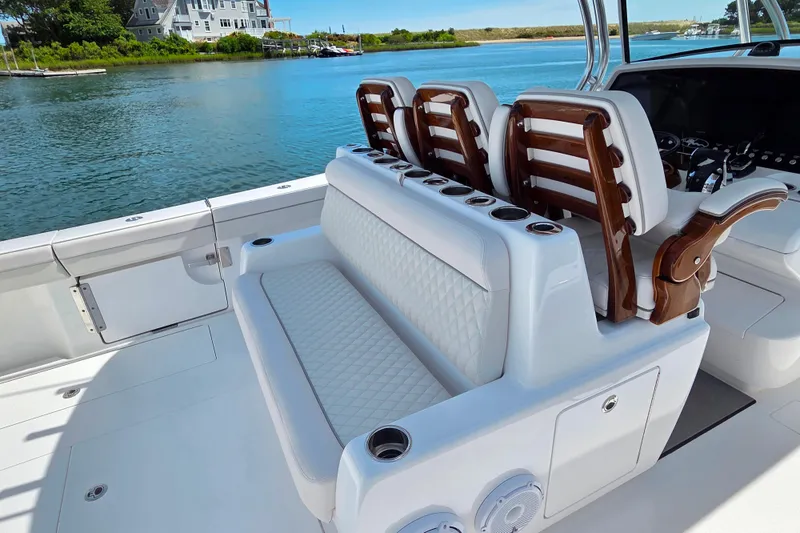 Slide: The Image of 2025 Valhalla Boatworks V-41 interior with luxurious seating and scenic waterfront view. - 11