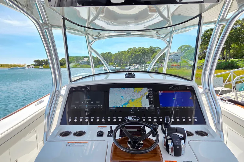 Slide: The Image of 2025 Valhalla Boatworks V-41 helm with advanced navigation displays and controls. - 12