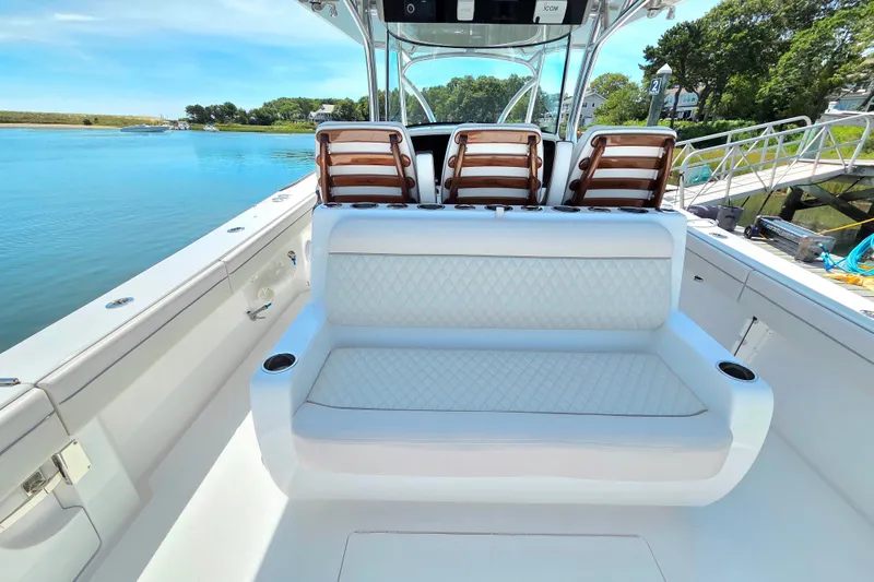Slide: The Image of 2025 Valhalla Boatworks V-41 interior with luxurious seating and scenic water view. - 15