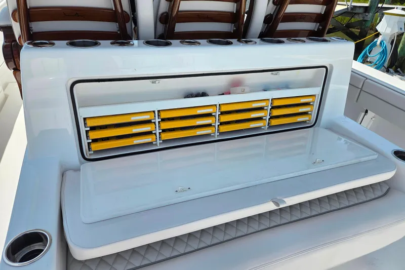 Slide: The Image of 2025 Valhalla Boatworks V-41 fishing tackle storage with yellow drawers and cup holders. - 16