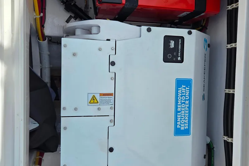 Slide: The Image of Seakeeper unit in 2025 Valhalla Boatworks V-41, featuring electrical hazard warning. - 18