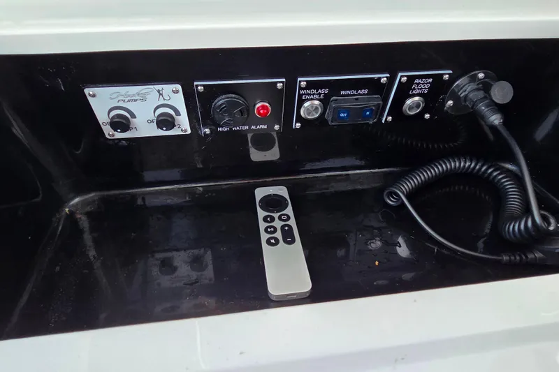 Slide: The Image of Control panel of 2025 Valhalla Boatworks V-41 with switches and remote. - 22