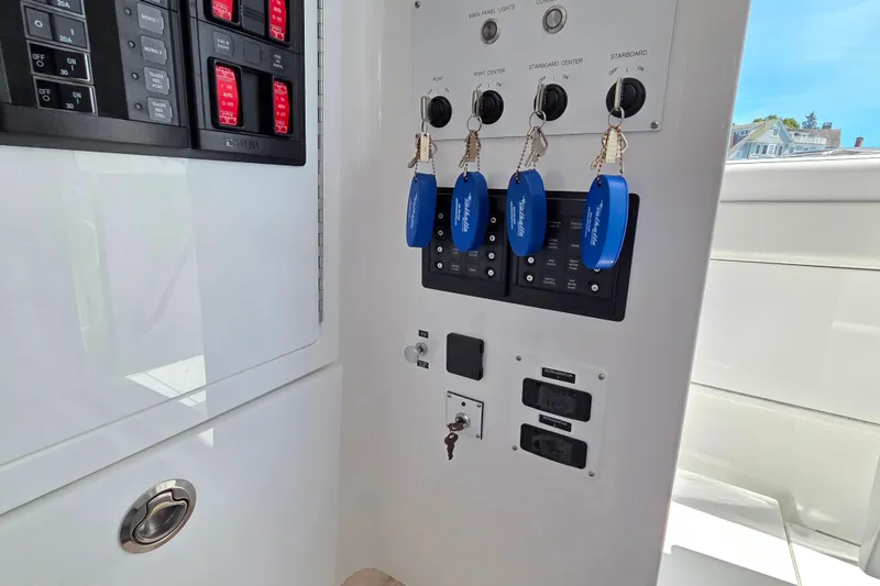 Slide: The Image of Control panel of 2025 Valhalla Boatworks V-41 with keys and switches. - 28
