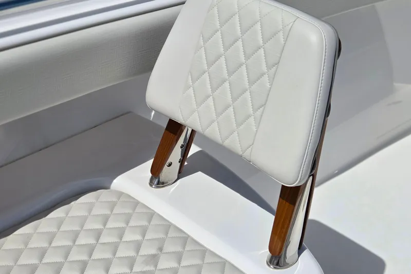 Slide: The Image of 2025 Valhalla Boatworks V-41 seat with diamond-stitched white upholstery and wooden accents. - 7