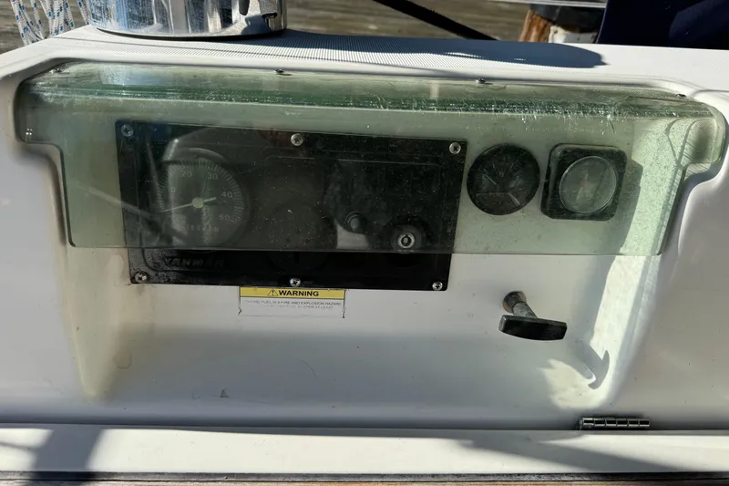 Slide: The Image of Control panel of a 2002 Beneteau Oceanis 393 sailboat with gauges and warning label. - 18