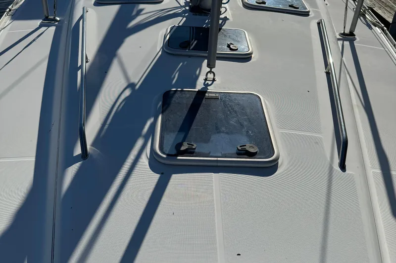 Slide: The Image of Deck of 2002 Beneteau Oceanis 393 sailboat with hatches and railings. - 23