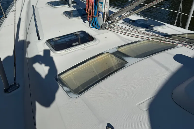 Slide: The Image of Deck of 2002 Beneteau Oceanis 393 sailboat with hatches and rigging. - 24