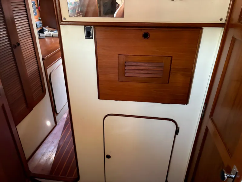 Slide: The Image of Interior of 1984 Irwin 41 sailboat with wooden cabinetry and doors. - 27