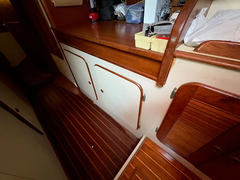 Slide: The Image of Interior of 1984 Irwin 41 sailboat with wooden cabinetry and flooring. - 33