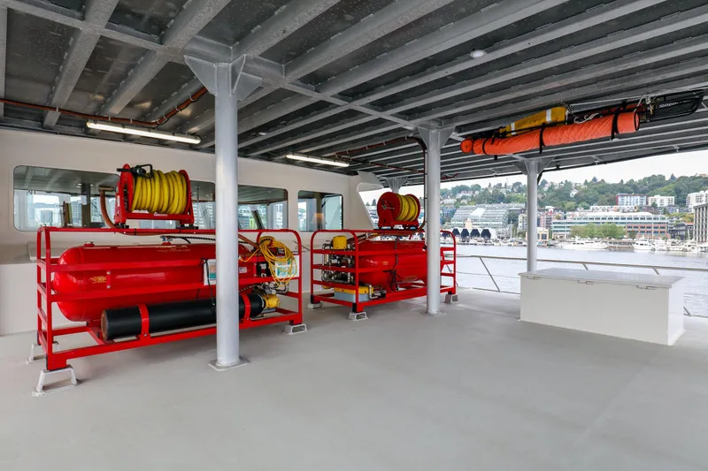 Slide: The Image of Interior of 2007 MetalCraft Catamaran with firefighting equipment and waterfront view. - 11