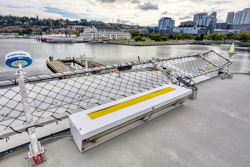 Slide: The Image of 2007 MetalCraft Catamaran docked in urban marina with cityscape background. - 21