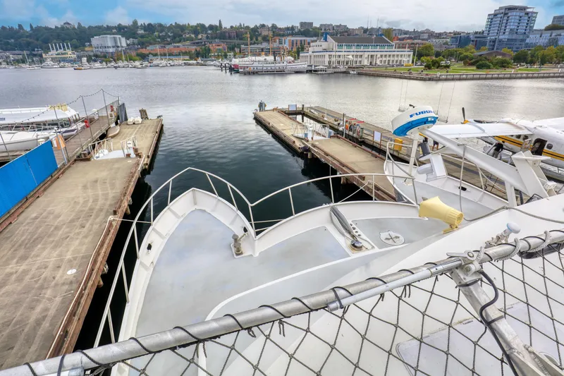 Slide: The Image of 2007 MetalCraft Catamaran docked at a scenic waterfront marina. - 22