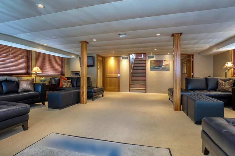 Slide: The Image of Luxurious interior of 2007 MetalCraft 92' Catamaran, featuring elegant seating and warm lighting. - 23