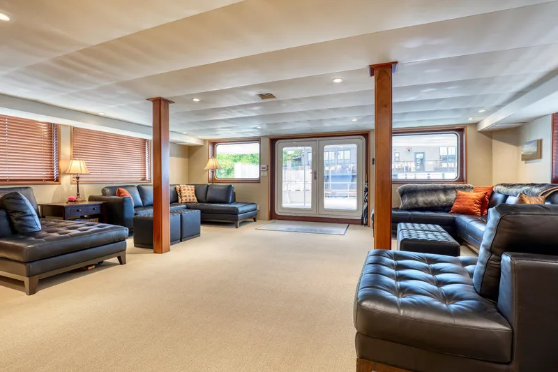 Slide: The Image of Luxurious interior of 2007 MetalCraft 92' Catamaran with elegant seating and large windows. - 24