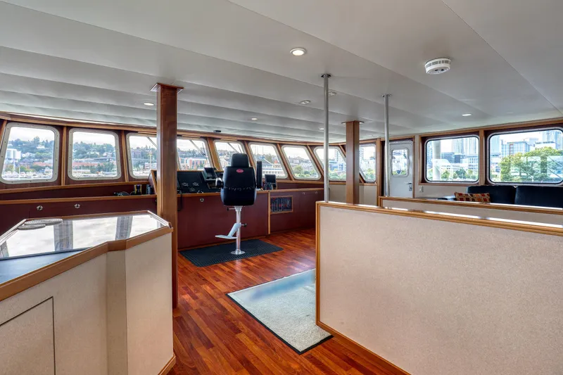 Slide: The Image of Luxurious interior of 2007 MetalCraft 92' Catamaran with panoramic windows and modern helm. - 29