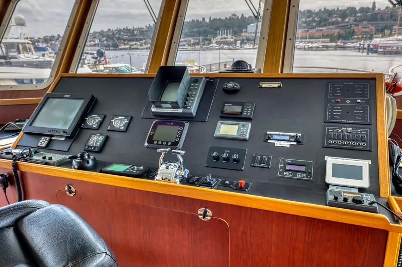 Slide: The Image of Control panel of a 2007 MetalCraft Catamaran with navigation and communication equipment. - 30