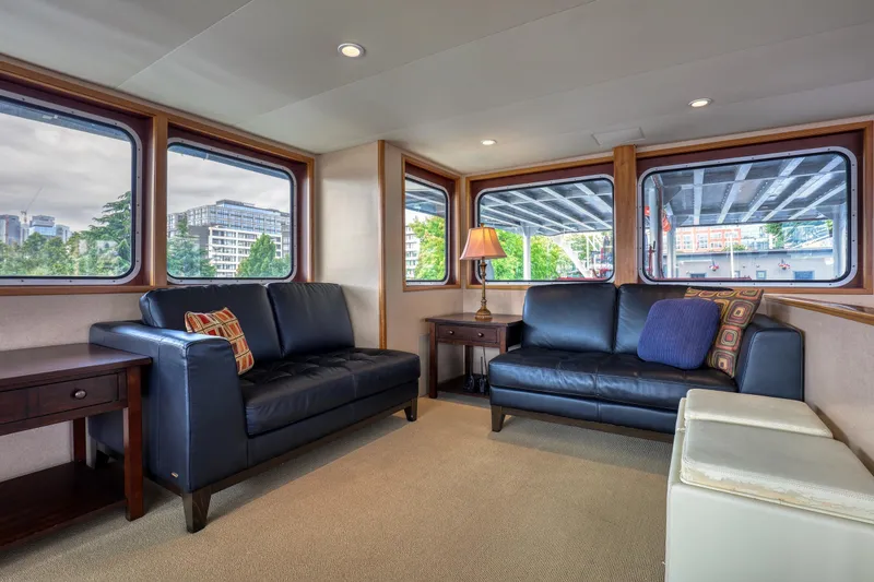 Slide: The Image of Luxurious 2007 MetalCraft Catamaran interior with leather sofas, large windows, and elegant decor. - 32