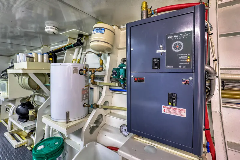 Slide: The Image of Engine room of 2007 MetalCraft Catamaran with Electro-Boiler and plumbing components. - 37