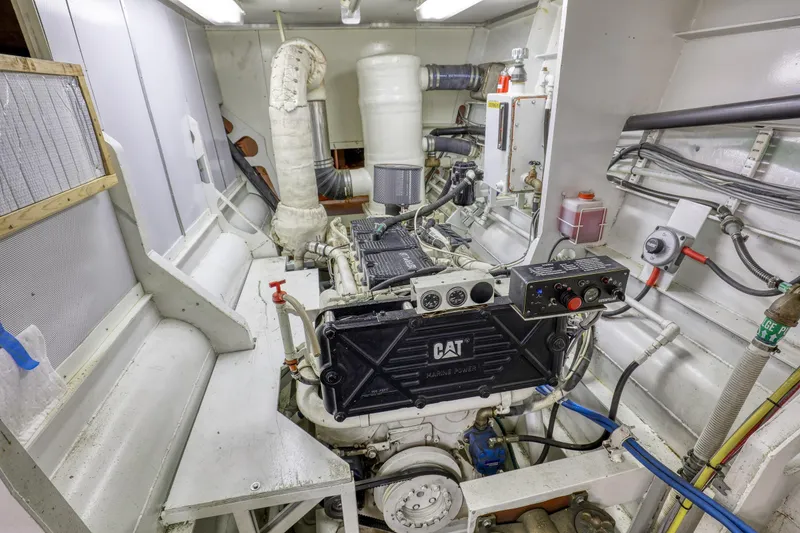 Slide: The Image of Engine room of a 2007 MetalCraft Catamaran featuring a CAT marine power engine. - 38