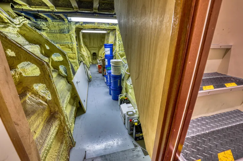 Slide: The Image of Engine room of a 2007 MetalCraft Catamaran with storage and equipment. - 41