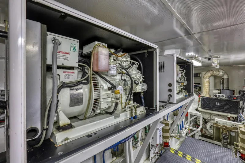 Slide: The Image of Engine room of a 2007 MetalCraft Catamaran, showcasing machinery and equipment. - 42