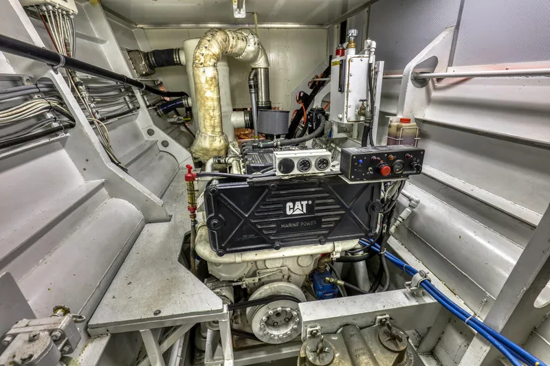 Slide: The Image of Engine room of a 2007 MetalCraft Catamaran featuring a CAT marine power engine. - 43