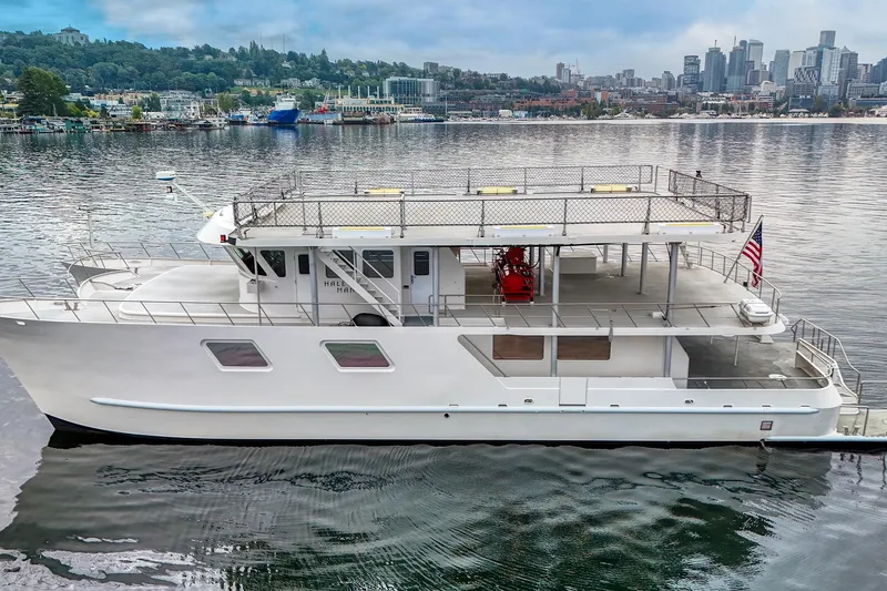 Slide: The Image of 2007 MetalCraft Catamaran docked with city skyline and waterfront view. - 8