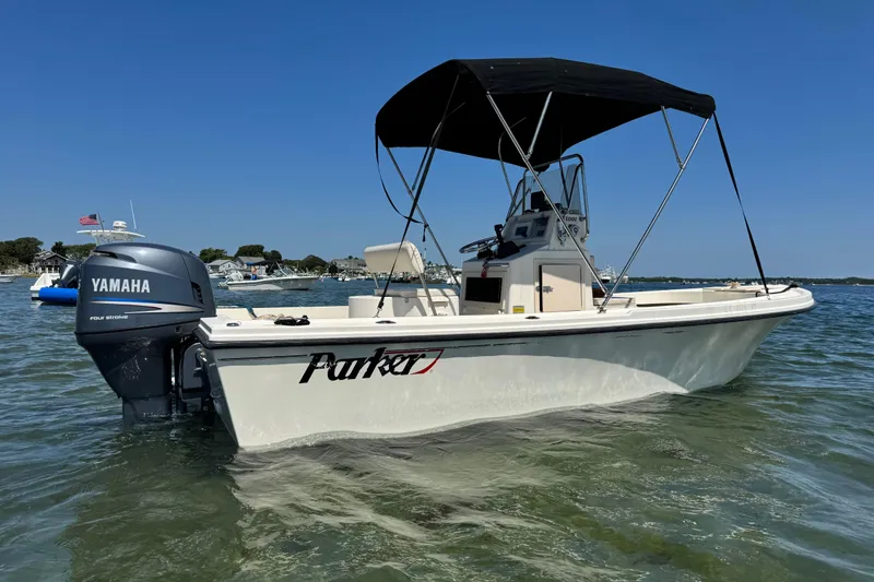 Slide: The Image of 2006 Parker 1801 Center Console boat with Yamaha engine on calm water. - 0