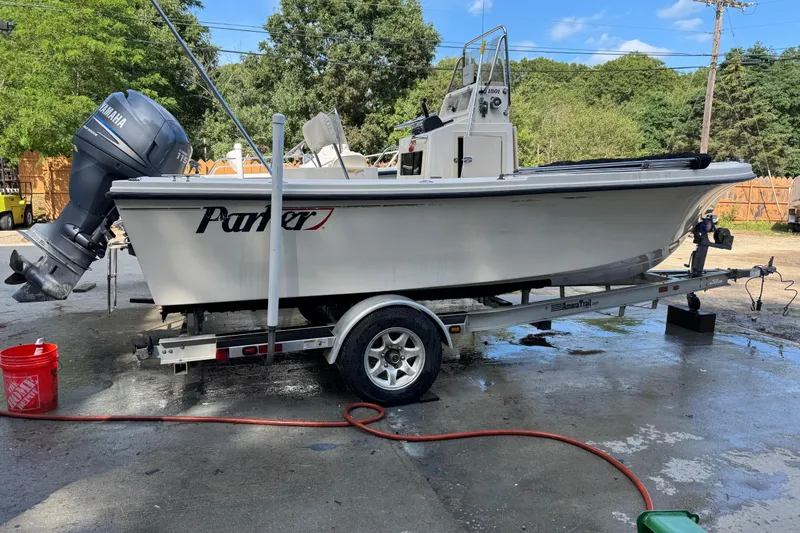 Slide: The Image of 2006 Parker 1801 Center Console boat on trailer, Yamaha engine, outdoor setting. - 5