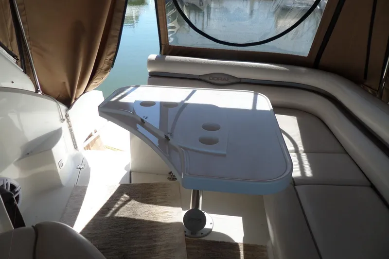 Slide: The Image of Interior of 2003 Doral 280 SE boat with seating and table. - 10