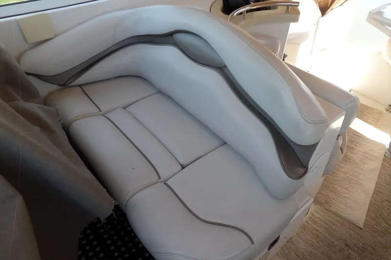 Slide: The Image of 2003 Doral 280 SE boat interior with white leather seating. - 13