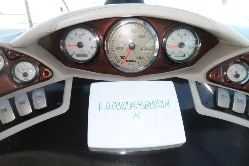 Slide: The Image of Dashboard of 2003 Doral 280 SE boat with gauges and Lowrance device. - 19