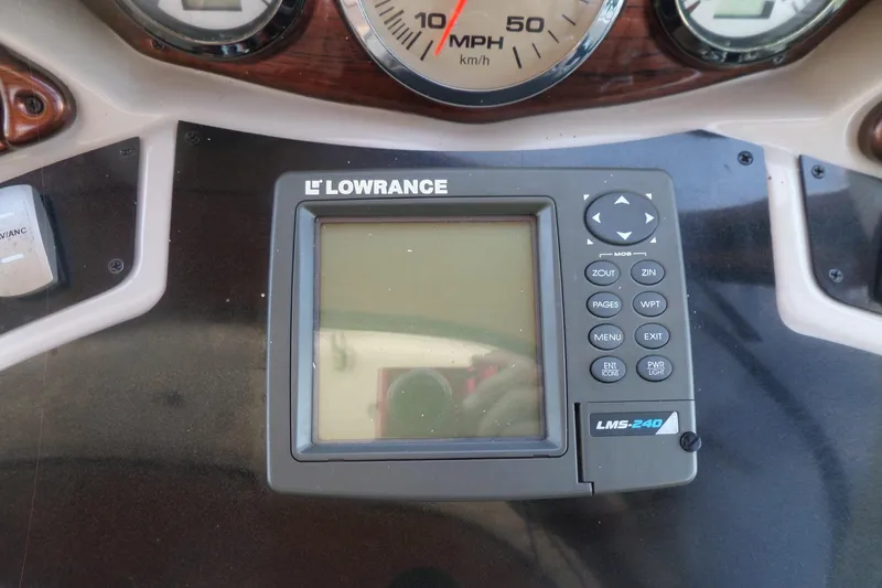 Slide: The Image of Lowrance LMS-240 marine GPS on 2003 Doral 280 SE dashboard. - 20