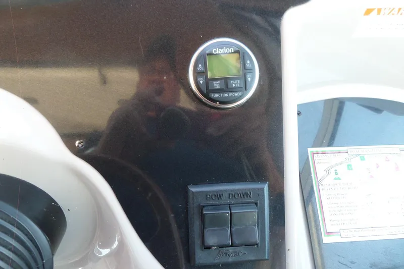 Slide: The Image of Control panel of a 2003 Doral 280 SE boat with Clarion audio system. - 23