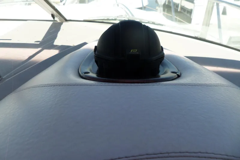 Slide: The Image of Dashboard of a 2003 Doral 280 SE boat with a compass. - 24