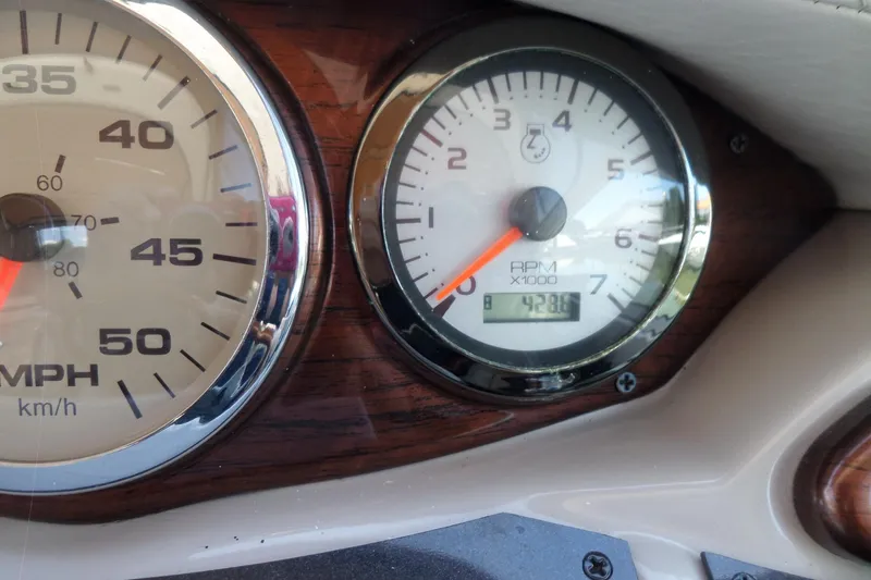 Slide: The Image of Dashboard of a 2003 Doral 280 SE boat showing speedometer and tachometer. - 30
