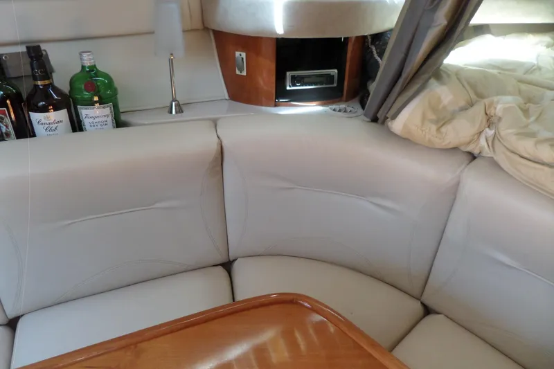 Slide: The Image of Interior of a 2003 Doral 280 SE yacht with leather seating and a mini bar. - 37