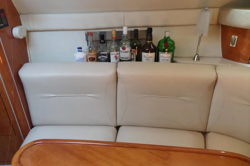 Slide: The Image of Interior of 2003 Doral 280 SE yacht with liquor bottles on a shelf. - 38