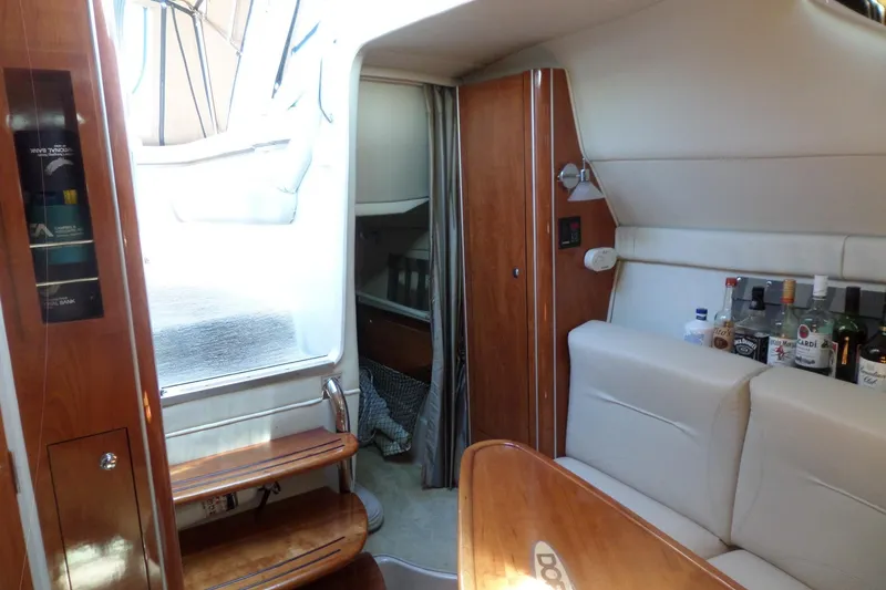 Slide: The Image of Interior of 2003 Doral 280 SE boat with seating and bar area. - 40