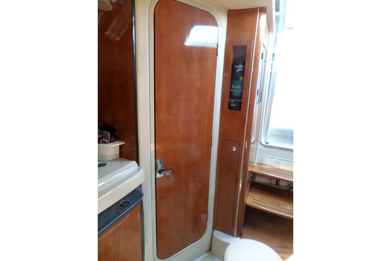 Slide: The Image of Interior of 2003 Doral 280 SE boat with wooden cabinetry and door. - 41