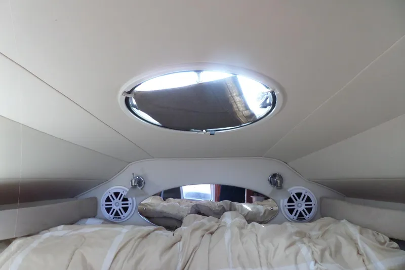 Slide: The Image of Interior cabin of 2003 Doral 280 SE boat with speakers and porthole. - 51