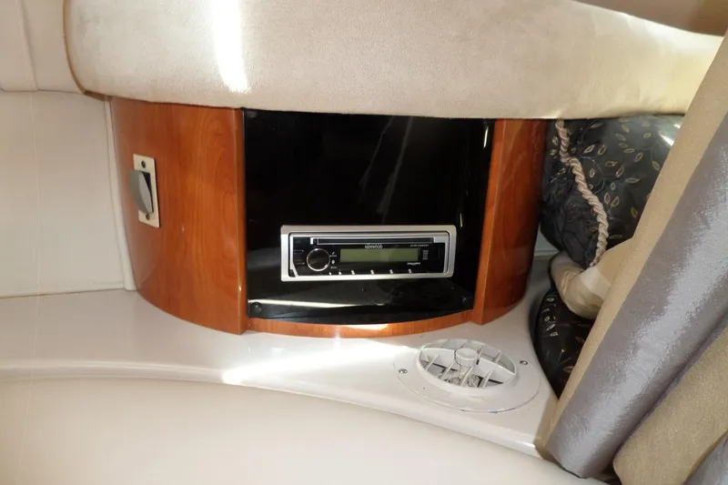 Slide: The Image of 2003 Doral 280 SE cabin interior with stereo system and wood paneling. - 52