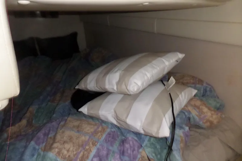 Slide: The Image of Cozy cabin interior of 2003 Doral 280 SE with pillows and bedding. - 55