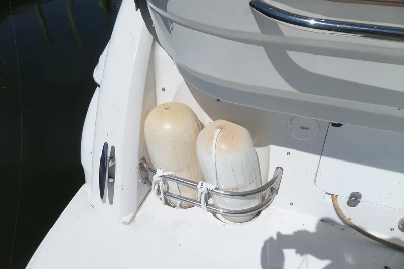 Slide: The Image of 2003 Doral 280 SE boat with fenders secured on the deck. - 6