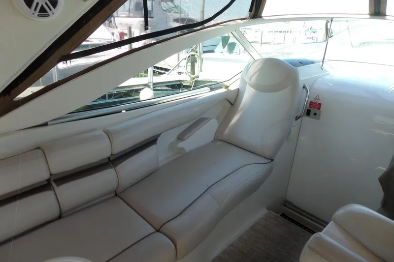 Slide: The Image of Interior of 2003 Doral 280 SE boat with white leather seating and modern design. - 7