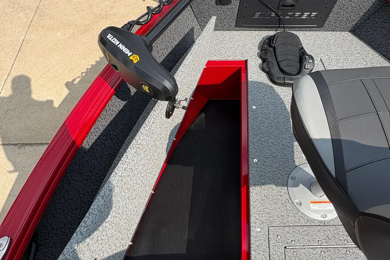 Slide: The Image of 2026 Lund 1800 Explorer SS boat interior with Minn Kota trolling motor and seating. - 14