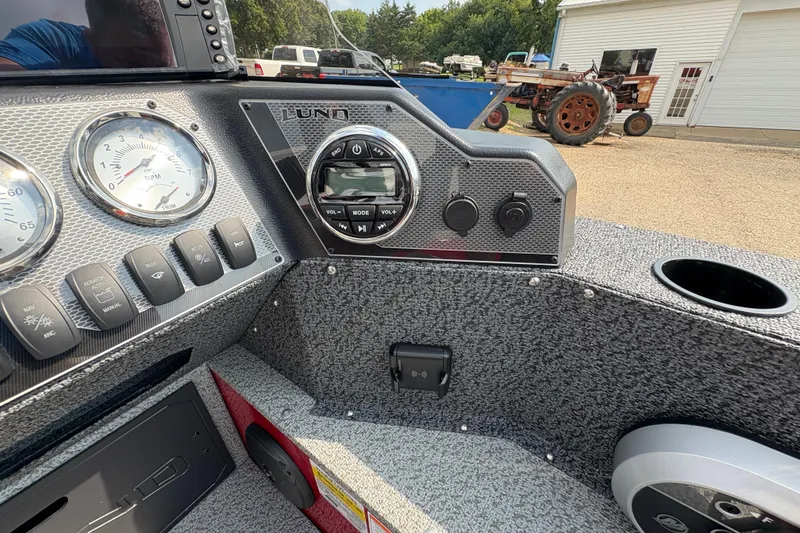 Slide: The Image of 2026 Lund 1800 Explorer SS dashboard with gauges and controls, featuring modern design elements. - 20