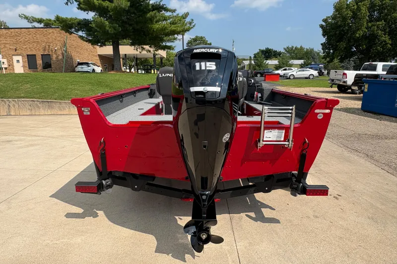 Slide: The Image of 2026 Lund 1800 Explorer SS boat with Mercury 115 engine, parked outdoors. - 3