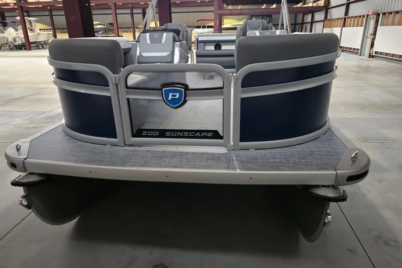 Slide: The Image of 2025 Premier 200 Sunscape pontoon boat in a warehouse setting. - 1
